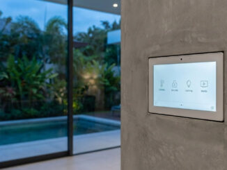 Integrated smart home control panel in a luxury villa showing climate and security settings.